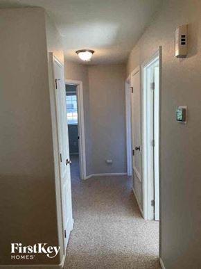 Oro Valley house for rent - a hallway with a door to a bathroom and a hall way