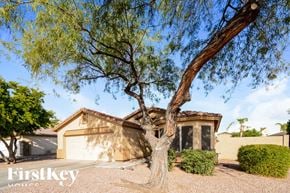 Surprise house for rent - A house with a tree in front of it.