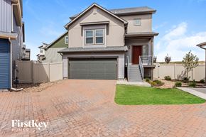Colorado Springs house for rent - a large house with a driveway and a garage door