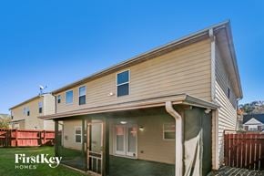 Lawrenceville house for rent - the exterior of a home with a wooden fence and a porch