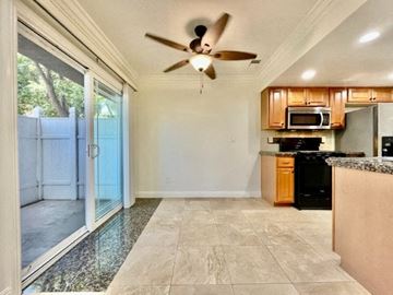 Costa Mesa apartment for rent - A kitchen with a black oven and wooden cabinets.
