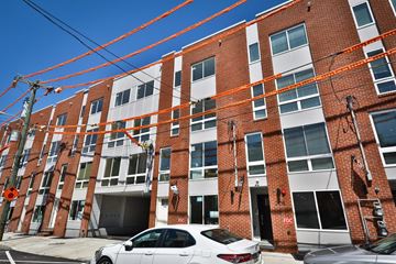 Philadelphia apartment for rent - an apartment building with a white car parked in front of it