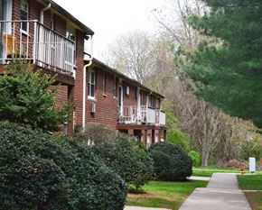 Elkton apartment for rent - a sidewalk in front of a brick apartment building