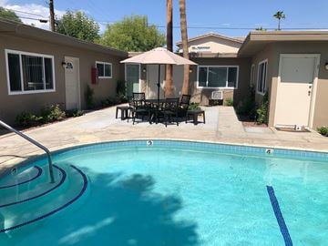 Palm Desert apartment for rent - a swimming pool in front of a house