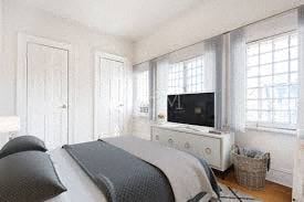Brooklyn apartment for rent - a bedroom with a bed and a television in it