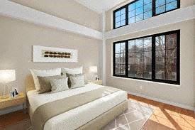 Brooklyn apartment for rent - a bedroom with a bed and a large window