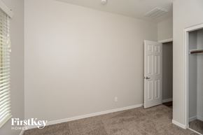 San Tan Valley house for rent - a bedroom with a white wall and a door to a closet
