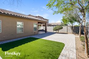 San Tan Valley house for rent - a house with a yard and a driveway and grass