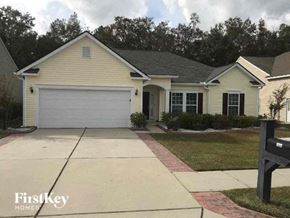 Goose Creek house for rent - a yellow house with a white garage door