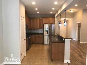 Goose Creek house for rent - a large kitchen with an island and a refrigerator