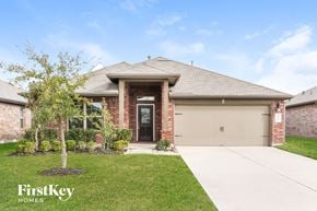 Katy house for rent - front view of a brick house with a garage door