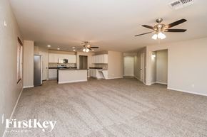 San Tan Valley house for rent - A spacious living room with a kitchen in the background.