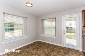 New Braunfels house for rent - A room with a tiled floor and a sliding door.