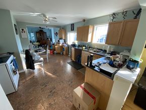 Snowden house for rent - a cluttered kitchen with a box on the floor