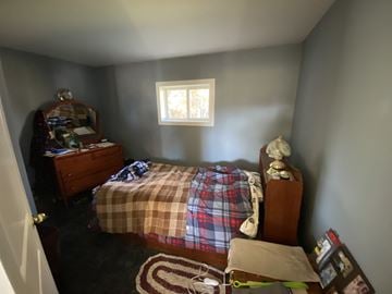 Snowden house for rent - a bedroom with a bed and a dresser in it