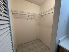 Wahiawa apartment for rent - A small, empty walk-in closet with a tile floor and white walls.