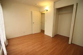 Waianae apartment for rent - A room with a white door and a brown floor.