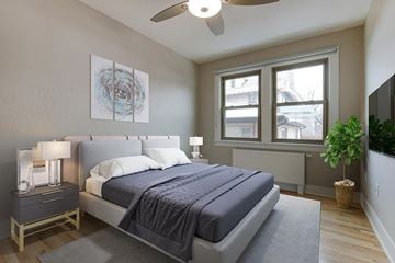 Denver apartment for rent - a bedroom with a bed and a ceiling fan