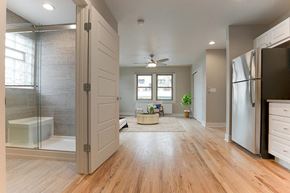 Denver apartment for rent - a large bathroom with a shower and a sink
