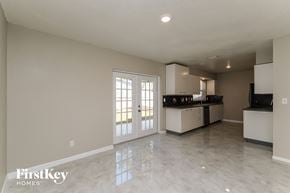 Tarpon Springs house for rent - A spacious kitchen and living room with a marble floor.