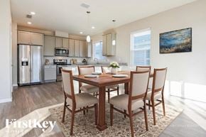 Jacksonville house for rent - A dining room with a wooden table and chairs.
