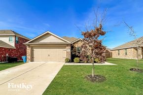 Seagoville house for rent - a home with a garage and a tree in the yard