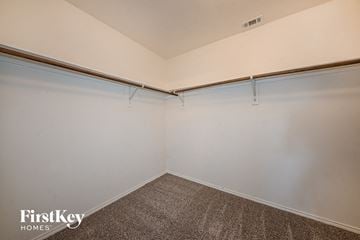 Seagoville house for rent - the living room of a garage with white walls and a carpet