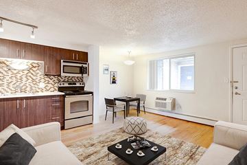 Denver apartment for rent - a living room with a couch and a table