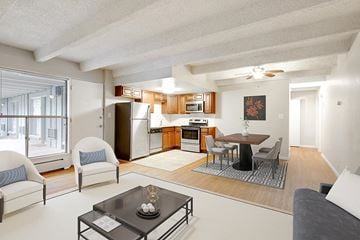 Denver apartment for rent - a living room and kitchen with a table and chairs