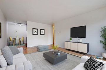 Denver apartment for rent - a living room with a couch and a table