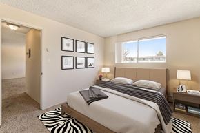 Lakewood apartment for rent - a bedroom with a bed and a window