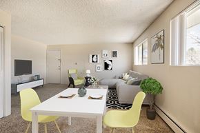 Lakewood apartment for rent - a living room with a white table and chairs