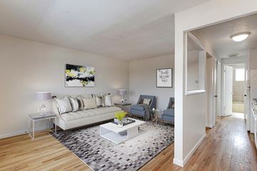 Denver apartment for rent - a living room with a couch and a table