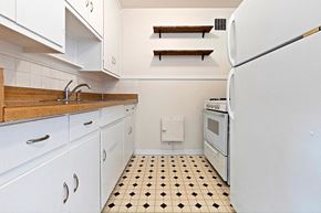 Denver apartment for rent - a kitchen with a stove refrigerator and a sink