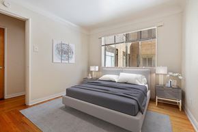 Denver apartment for rent - a bedroom with a bed and a window