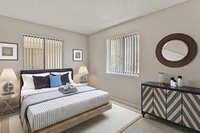 Denver apartment for rent - a bedroom with a bed and a dresser