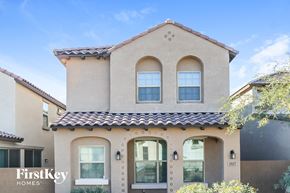 Mesa house for rent - A house with a beige facade and a brown roof is for sale.