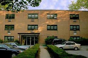 Brookline apartment for rent - a brick building with cars parked in front of it