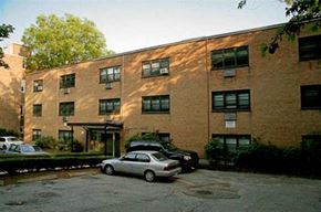 Brookline apartment for rent - a brick building with cars parked in front of it