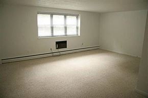 Brookline apartment for rent - an empty room with a window and a carpet floor