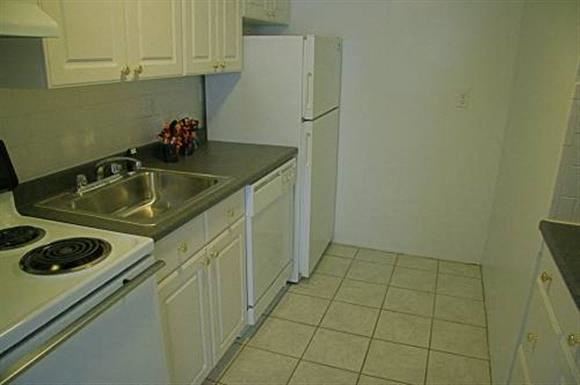 Brookline apartment for rent - a kitchen with a sink and a refrigerator