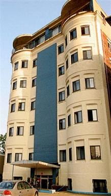 Allston apartment for rent - a tall building with a car parked in front of it