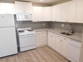 Brighton apartment for rent - Kitchen with Granite Counters, White Appliances and Laminate Flooring