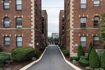 Somerville apartment for rent - an empty street between two brick apartment buildings
