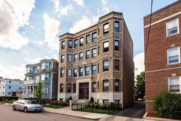 Allston apartment for rent - a brick building with a car parked in front of it