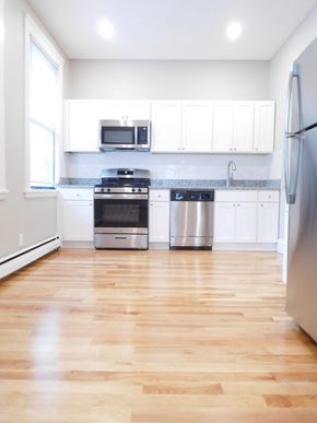 Allston apartment for rent - Renovated Kitchen with Large Windows, White Cabinets, Granite Counters, Stainless Appliances and Hardwood Floors