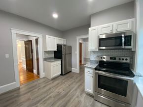 Worcester apartment for rent - Kitchen with Stainless Appliances, Granite Counters, Gray Laminate Flooring