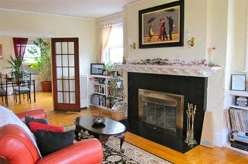 Worcester apartment for rent - a living room with a fireplace and a red couch