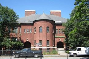 Worcester apartment for rent - a brick building with cars parked in front of it