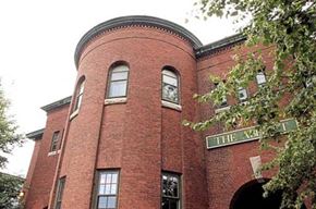 Worcester apartment for rent - a brick building with a clock on the front of it